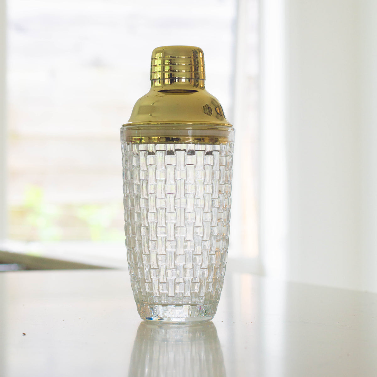 Glass shaker with gold lid